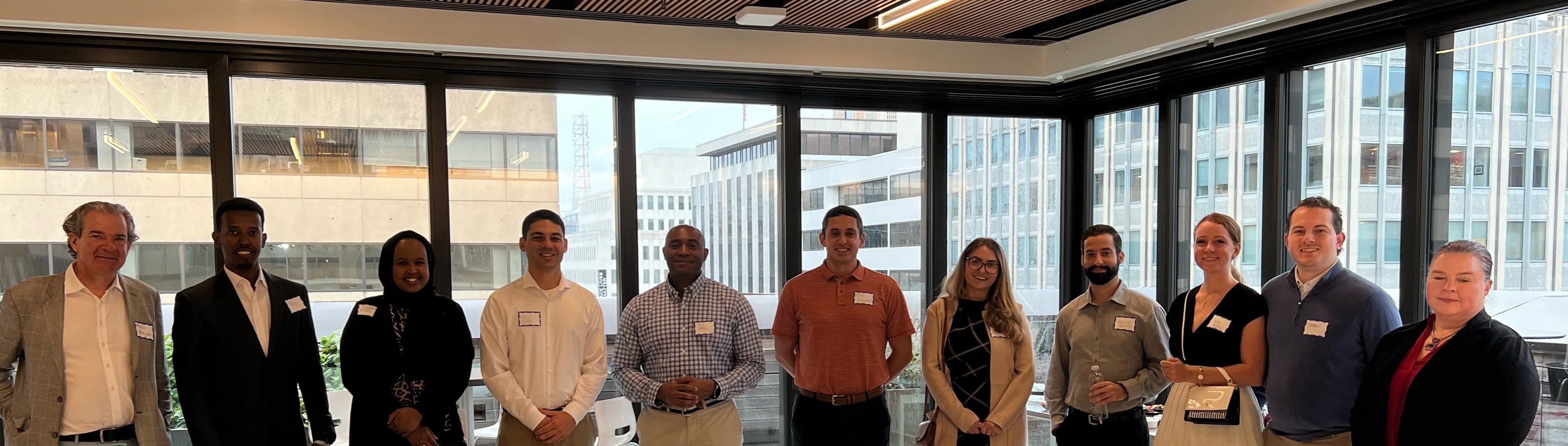 ASU students and alumni pose for group photo at networking event.