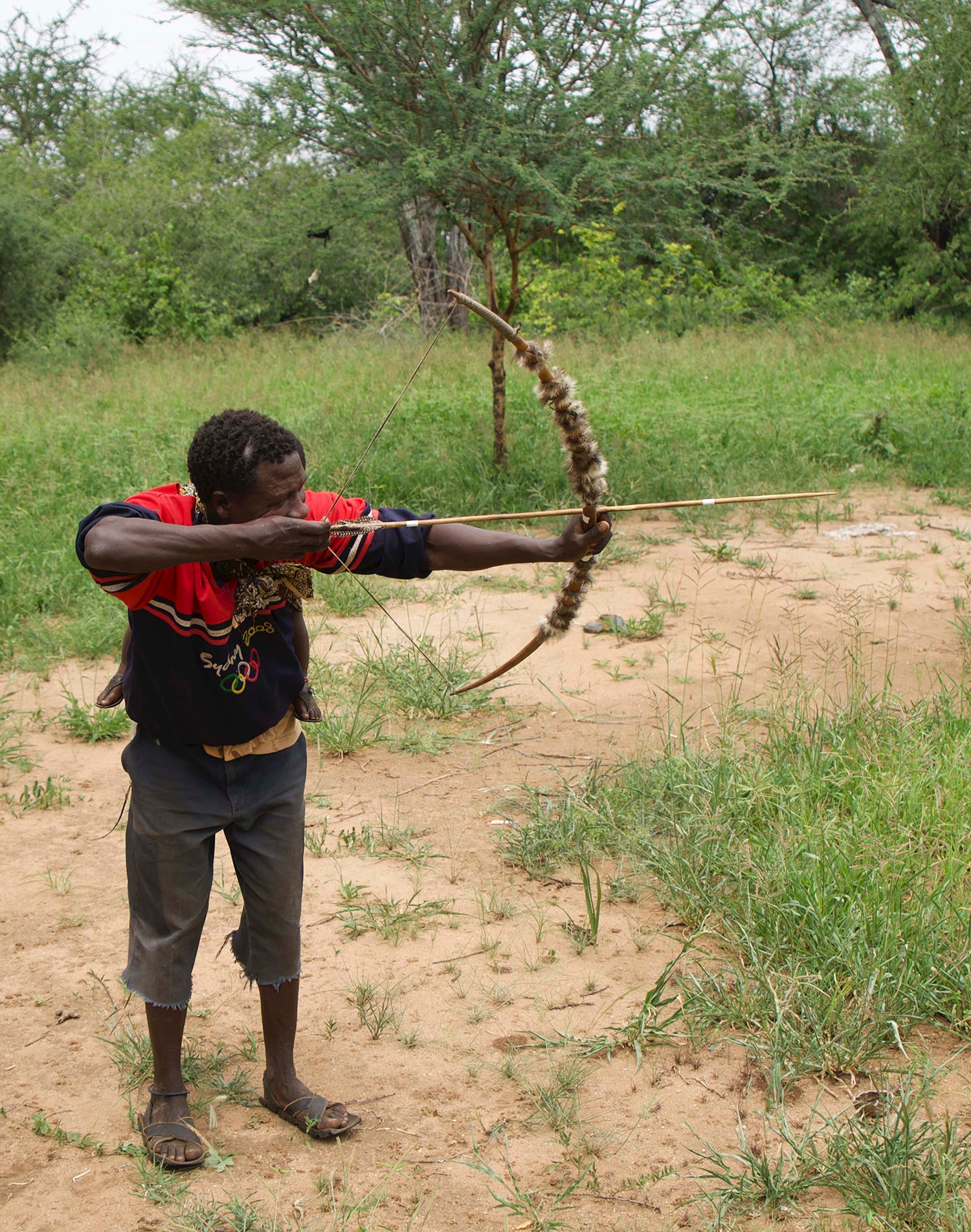 Hadza man with bow