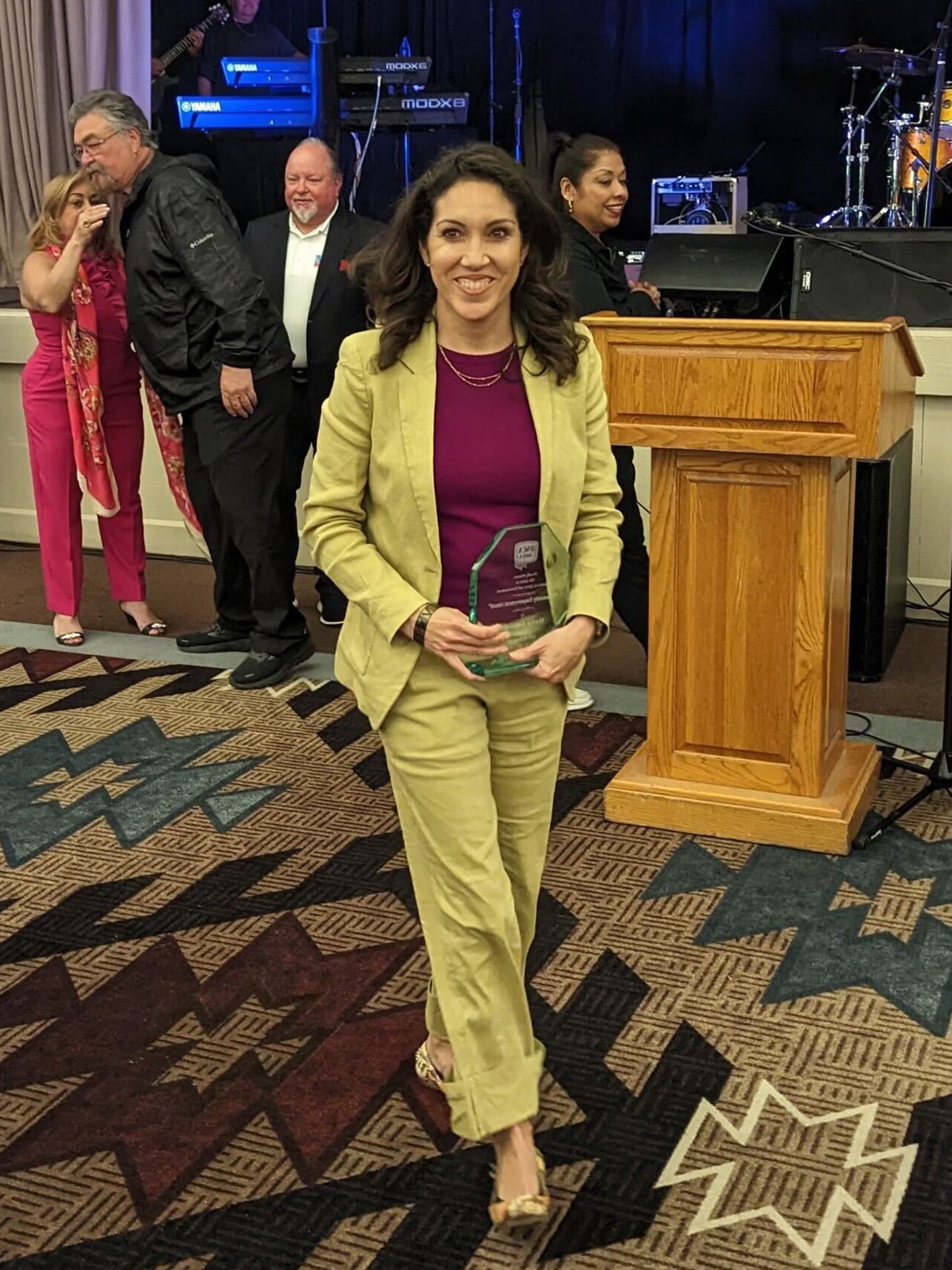 Woman holding award