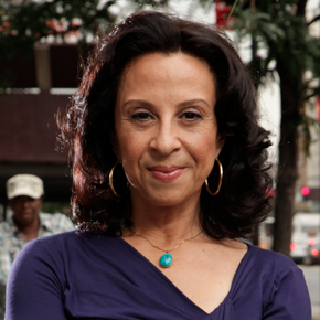 Woman with brown hair and purple shirt