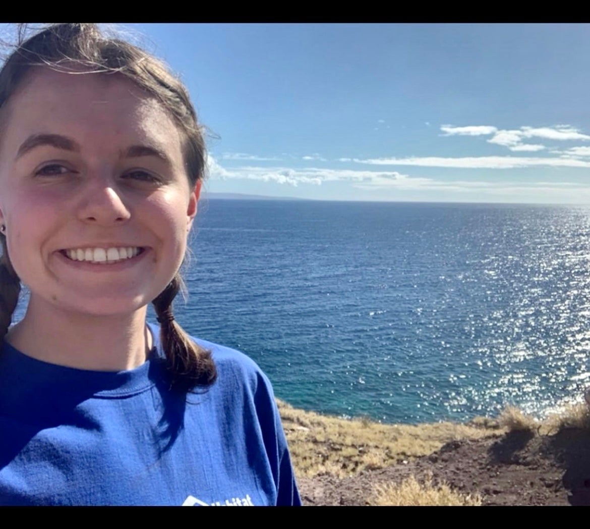 Smiling girl with ocean in background