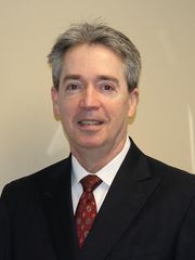 Man in suit and red tie