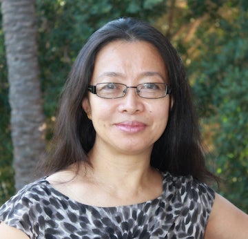 Woman with brown hair smiling