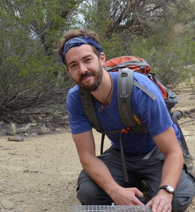 ASU School of Life Sciences professor Nate Upham conducting populations genetics fieldwork