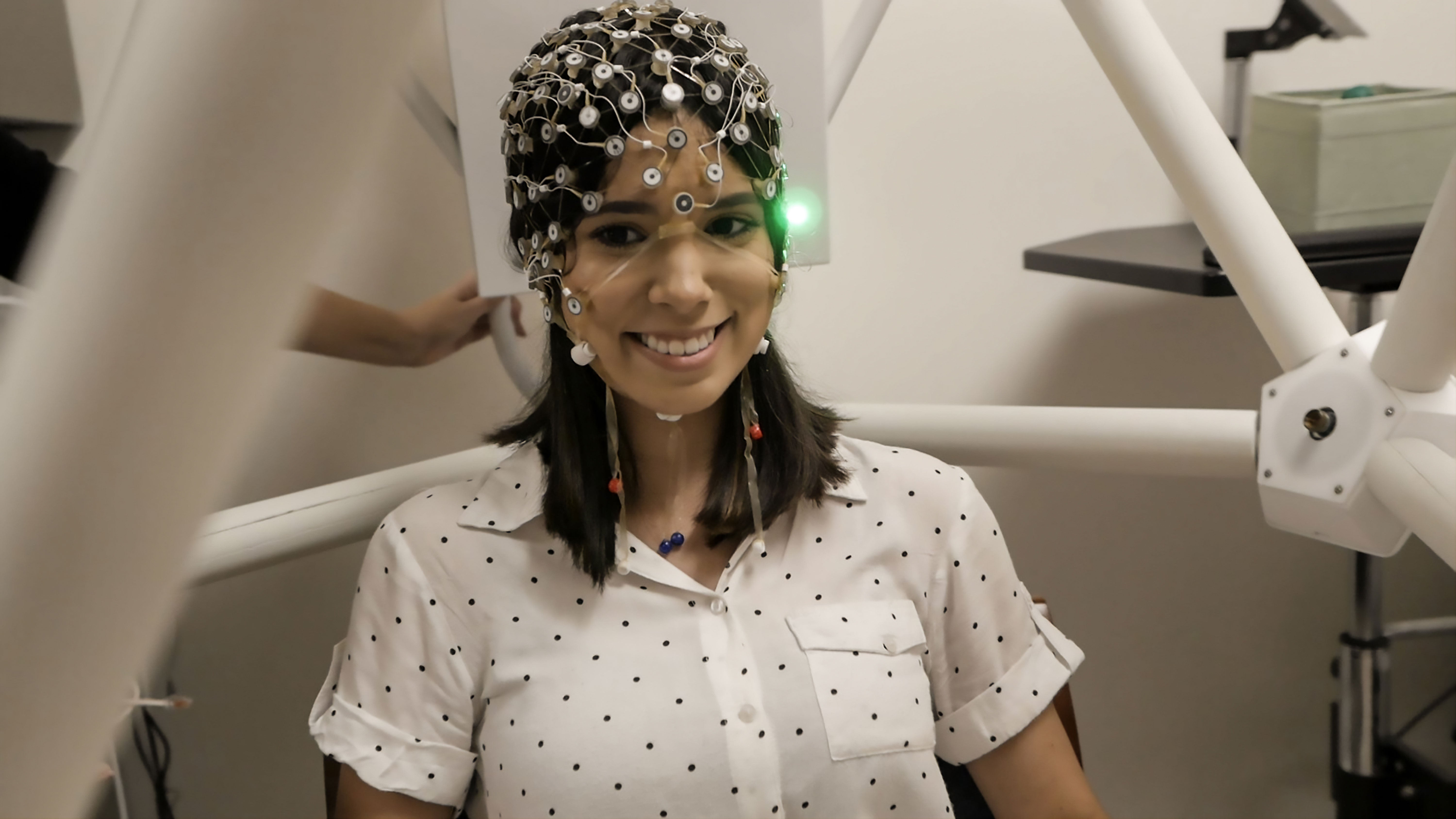 woman wearing cap with electrical nodes