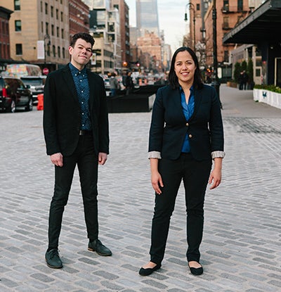 man and woman standing in the street