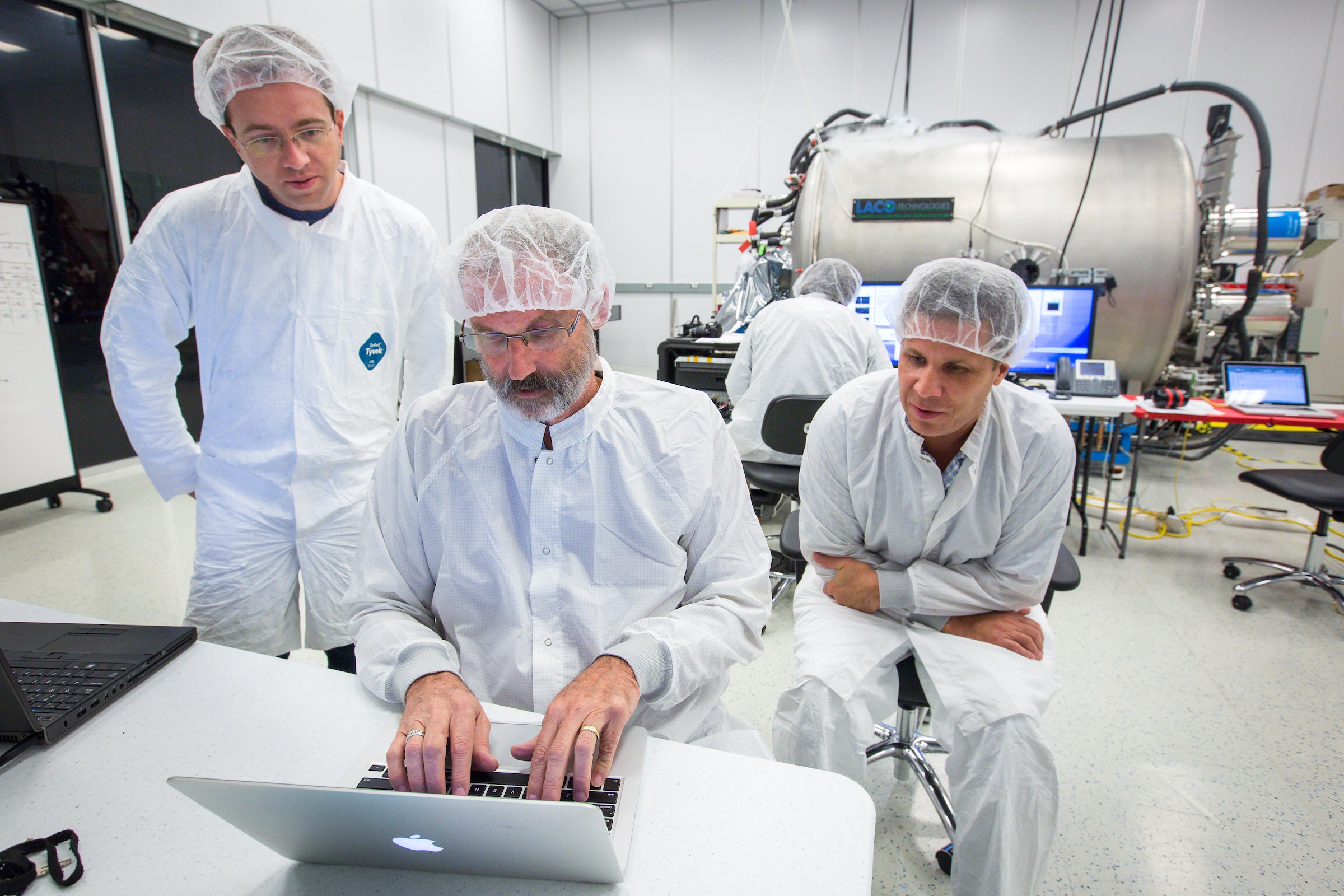 Scientists work in a clean lab