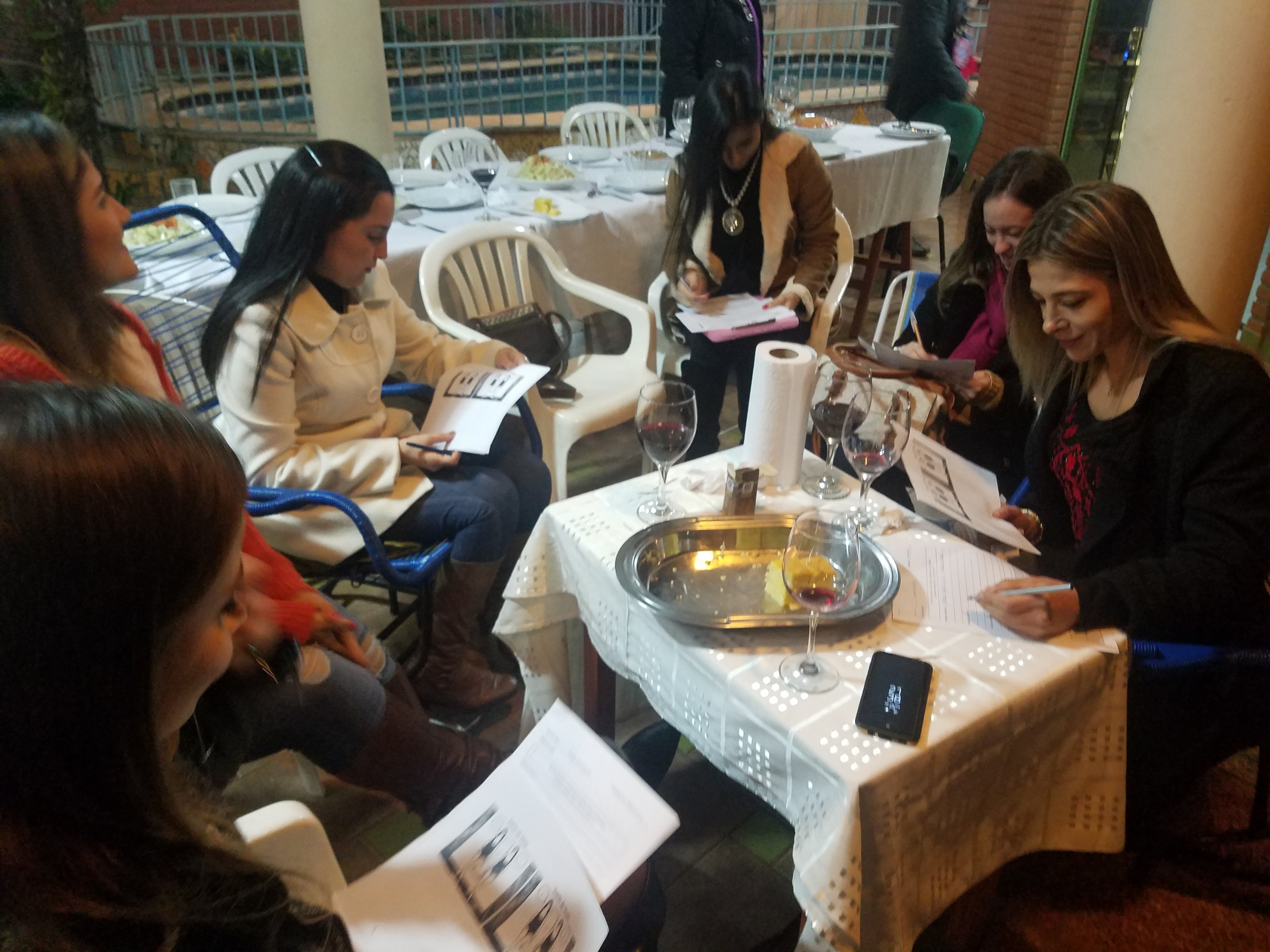 women sitting at a table in a cafe