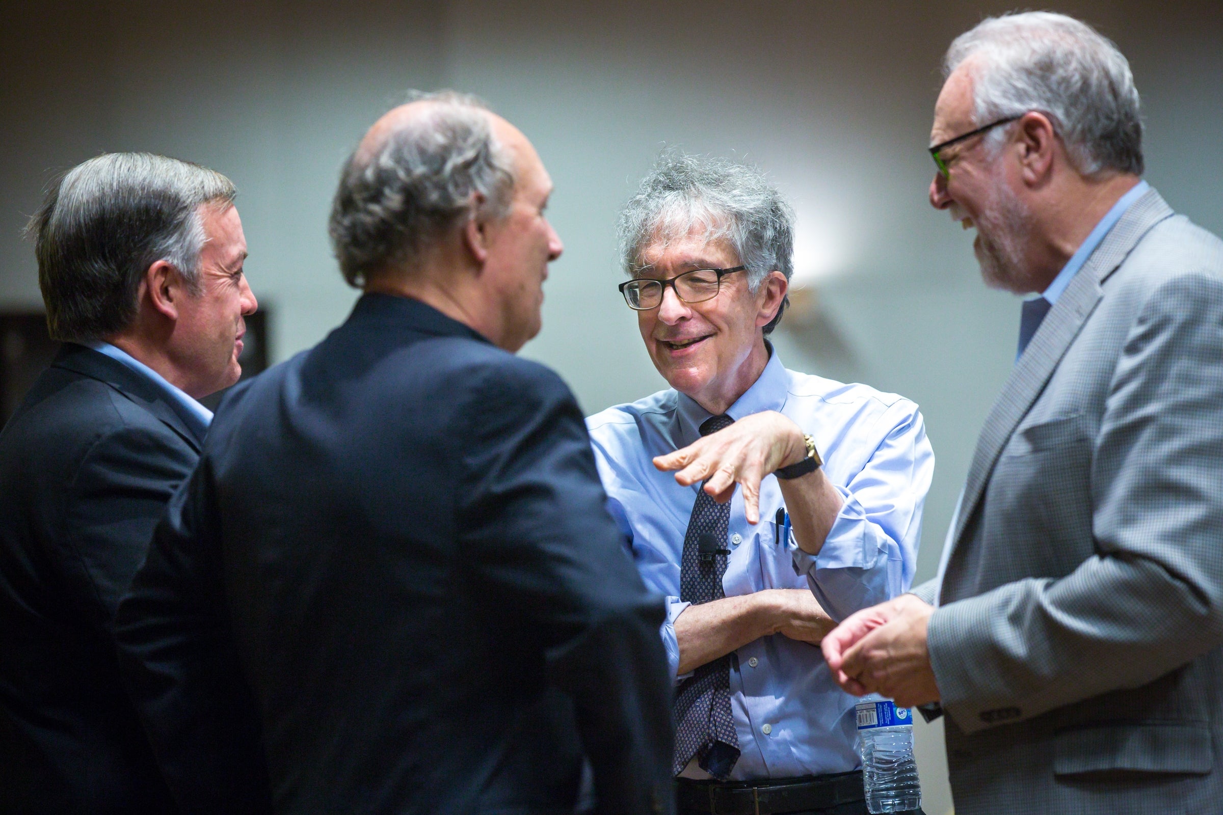 Harvard professor Howard Gardner speaks with ASU President Michael Crow and others.