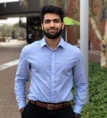 Young man in blue shirt and slacks