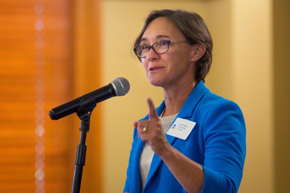 Woman in front of microphone