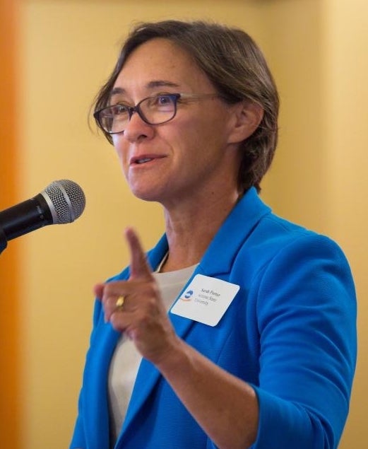 Woman speaking at microphone