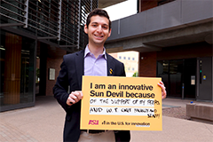 student holding sign that says "I am an innovative Sun Devil because of the the support of my peers and W. P. Carey faculty and staff!"