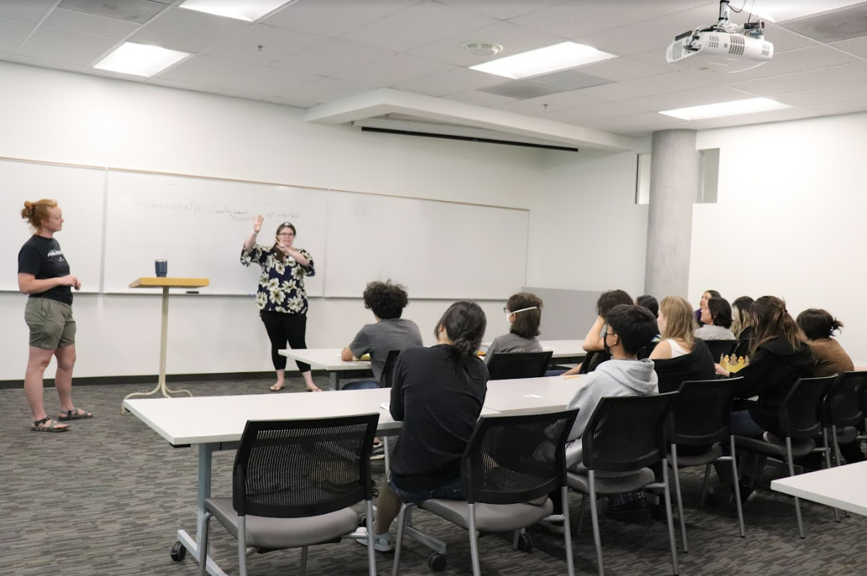 PhD candidate Aubrial Harrington and Angela Barnes lead a discussion with the campers.