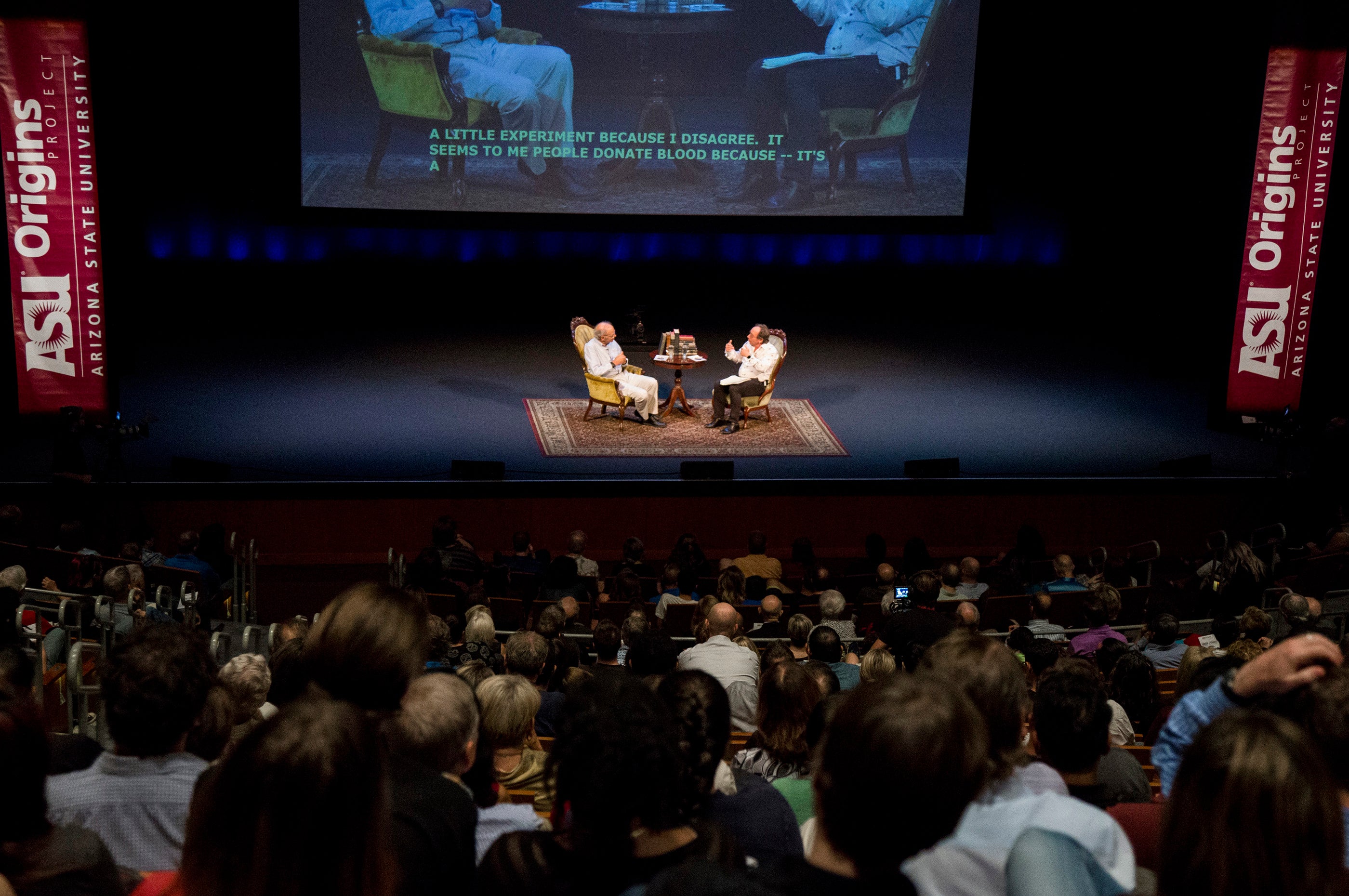 Animal-rights philosopher Peter Singer and theoretical physicist Lawrence Krauss on stage