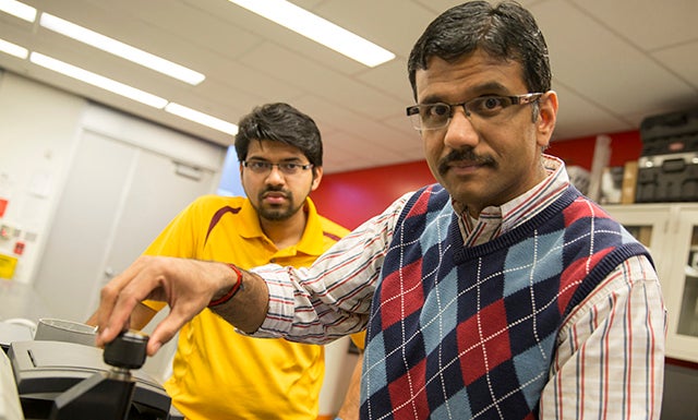 Guys looking cool in a lab.