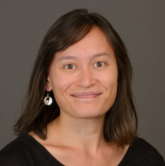 Woman with brown hair smiling