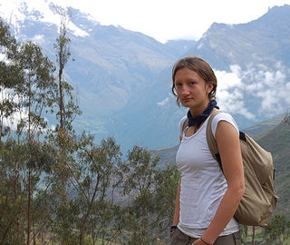 Woman standing in front of a cool scene.