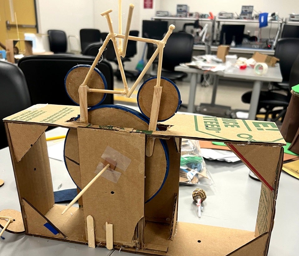 Prototype for a flying steampunk bicycle automata made of wood and cardboard.