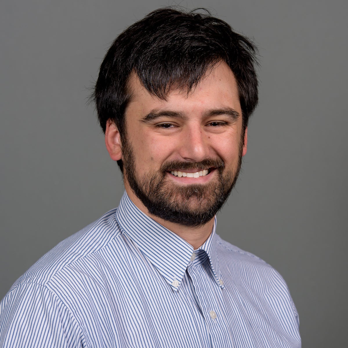 Man with mustache and beard smiling