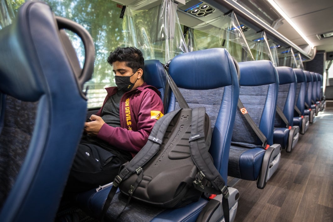 Student riding on a bus