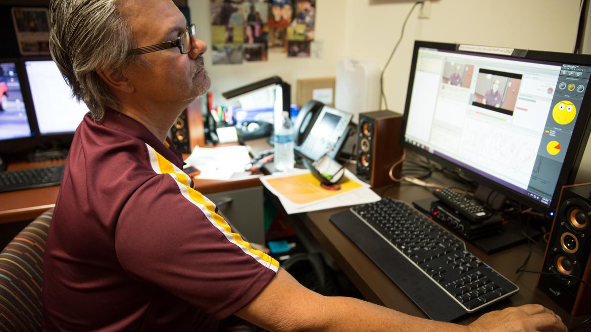 man watching video using facial reading tech