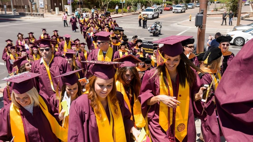 graduates walking into convention center