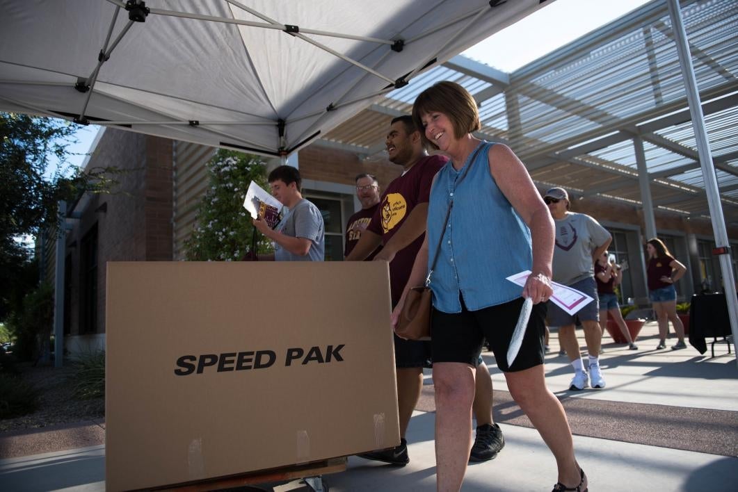 Families move their students into the dorms at the West campus.