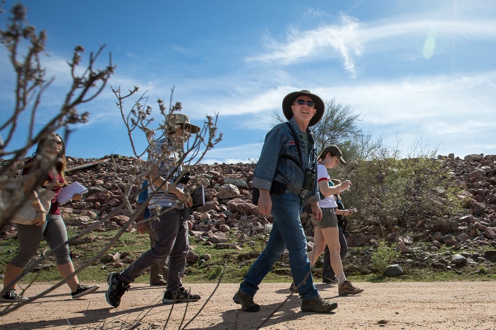 Chew leads his class along the river bed