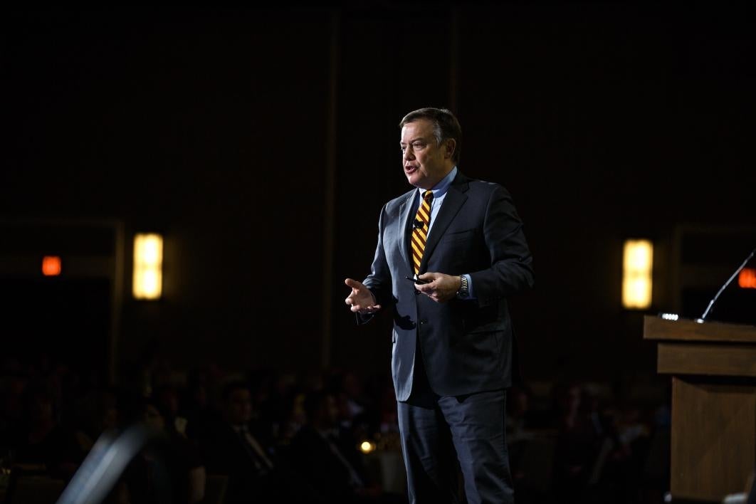 man speaking on stage