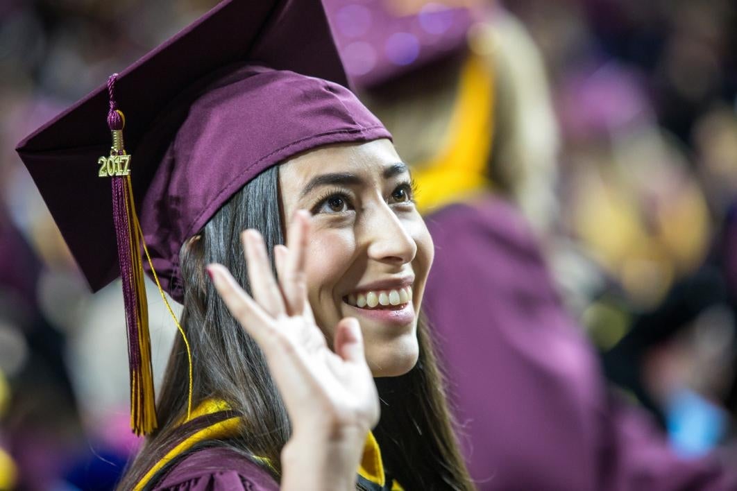 graduate waving