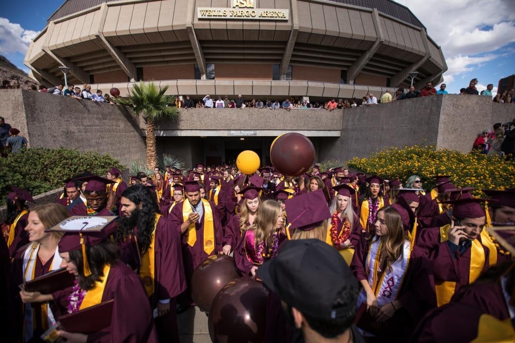 graduates leaving building