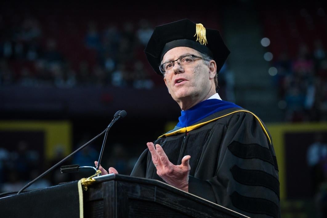 man speaking at podium