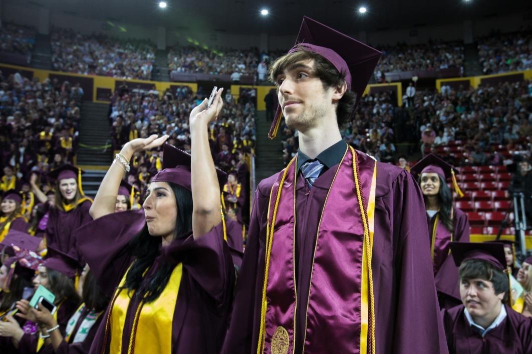 students standing at convocation