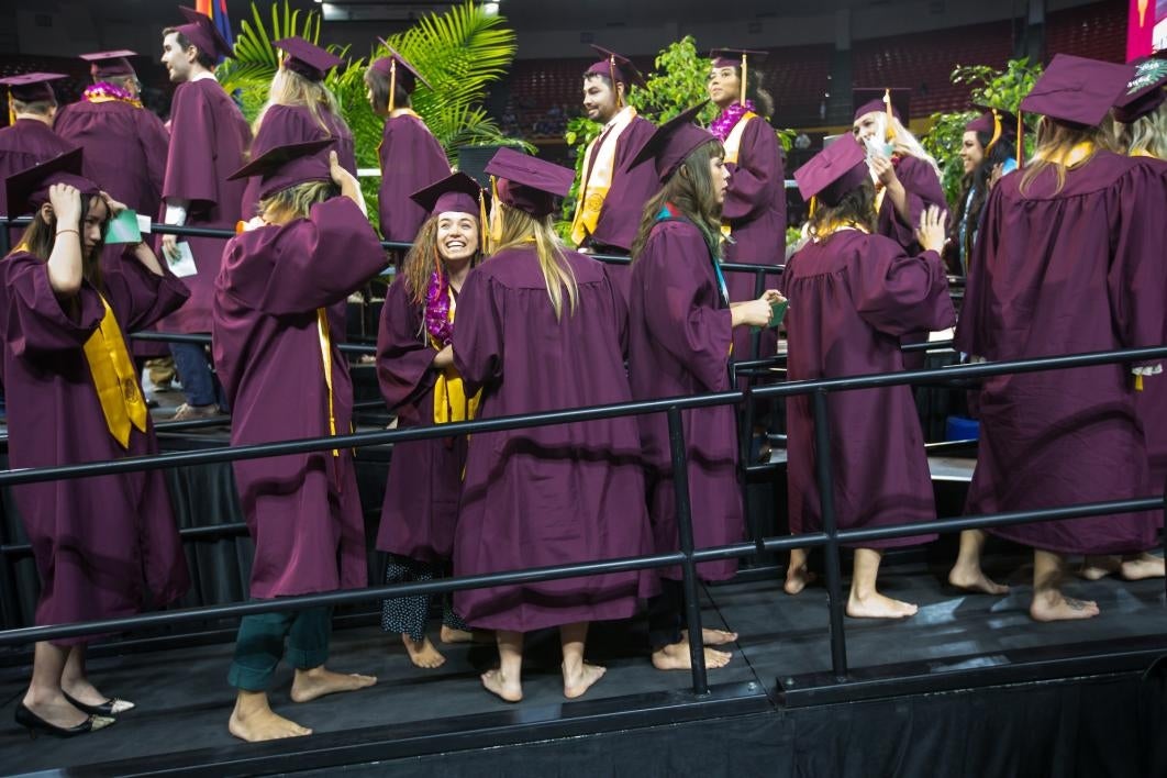 graduates waiting by stage