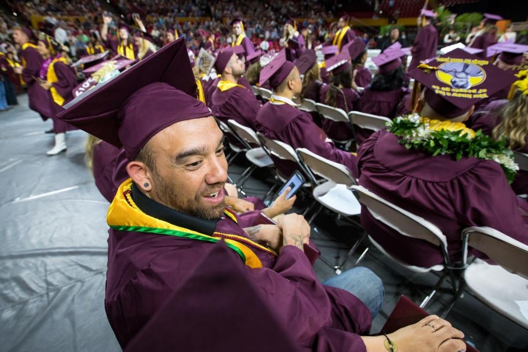 graduate sitting at convocation