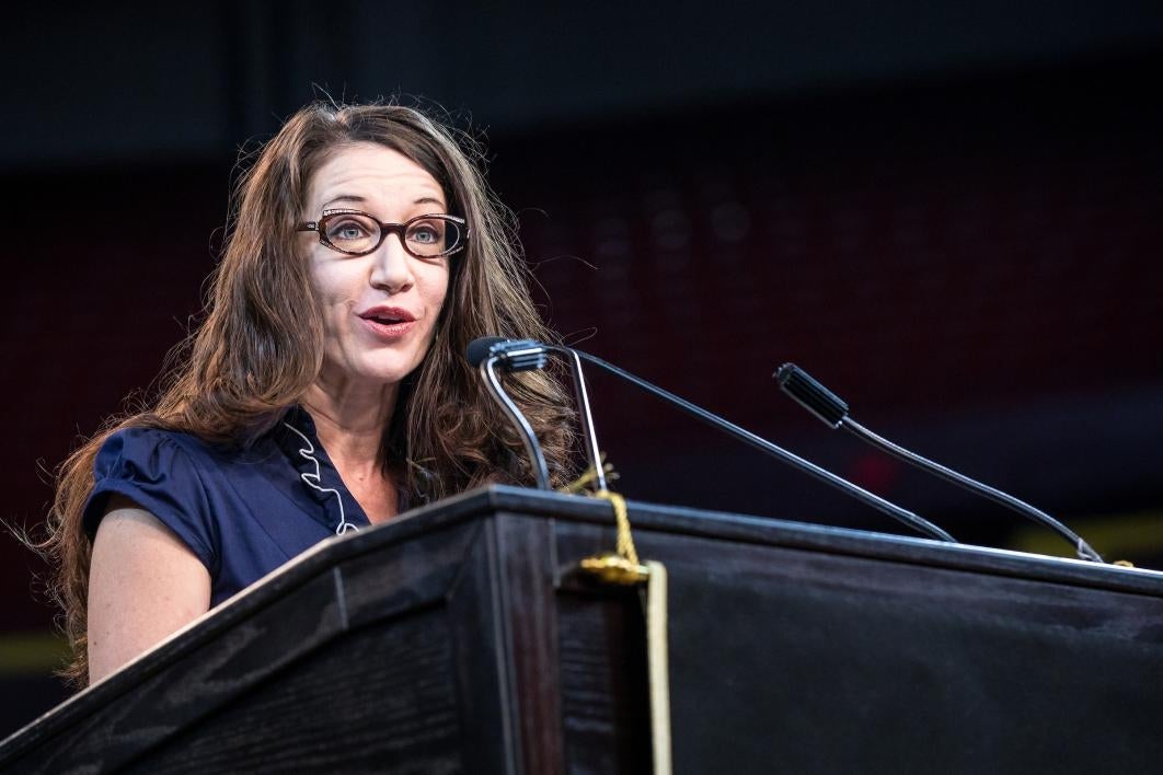 woman speaking at podium