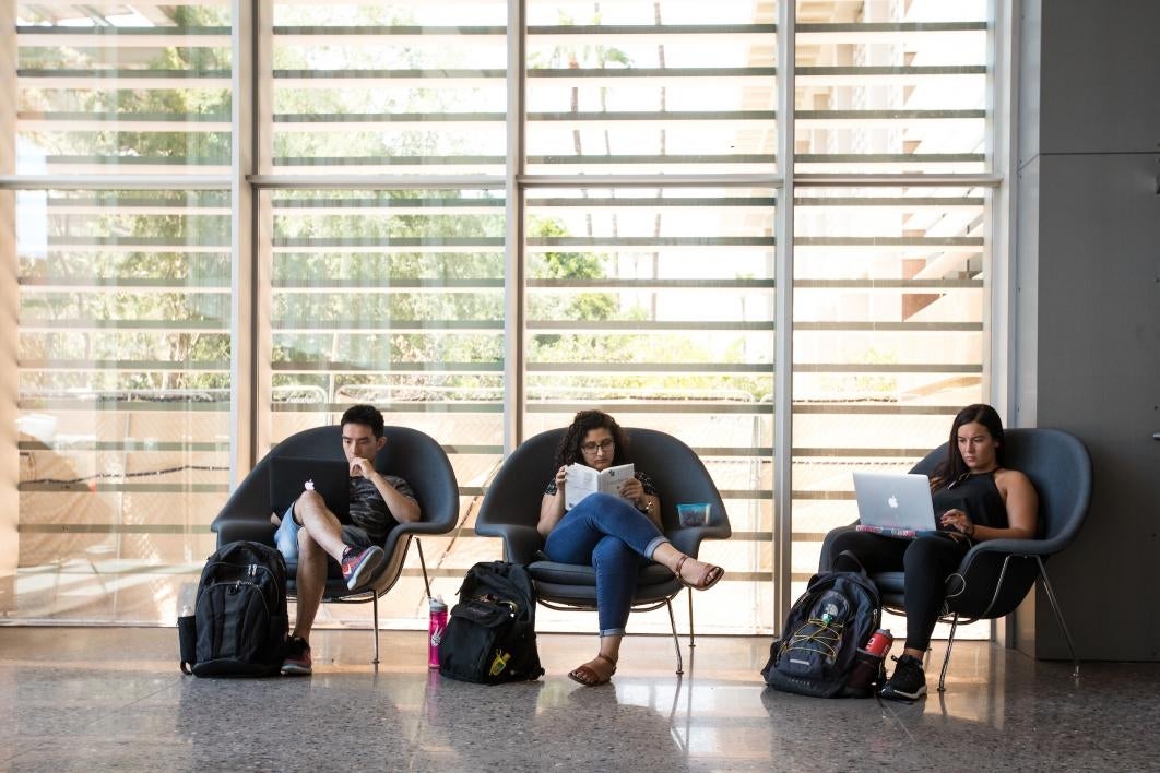 students studying in oversize chairs