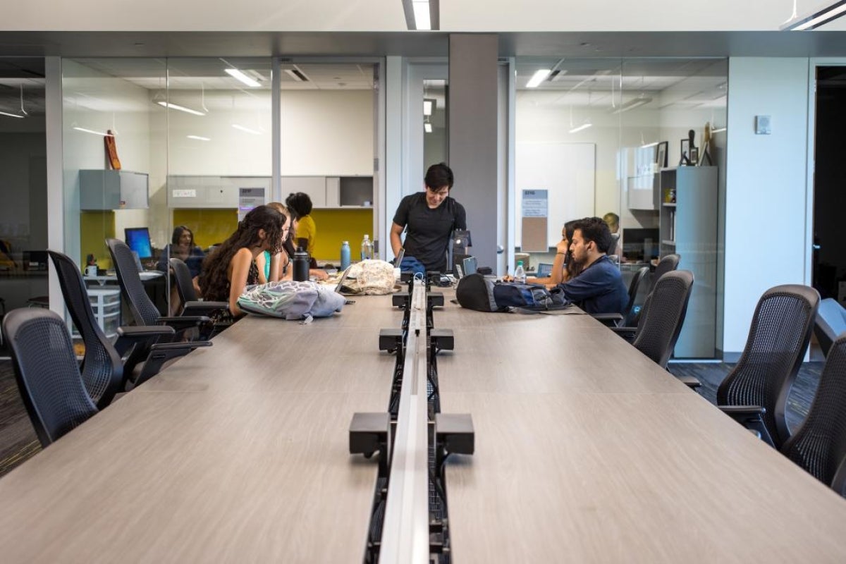 students studying on long community table