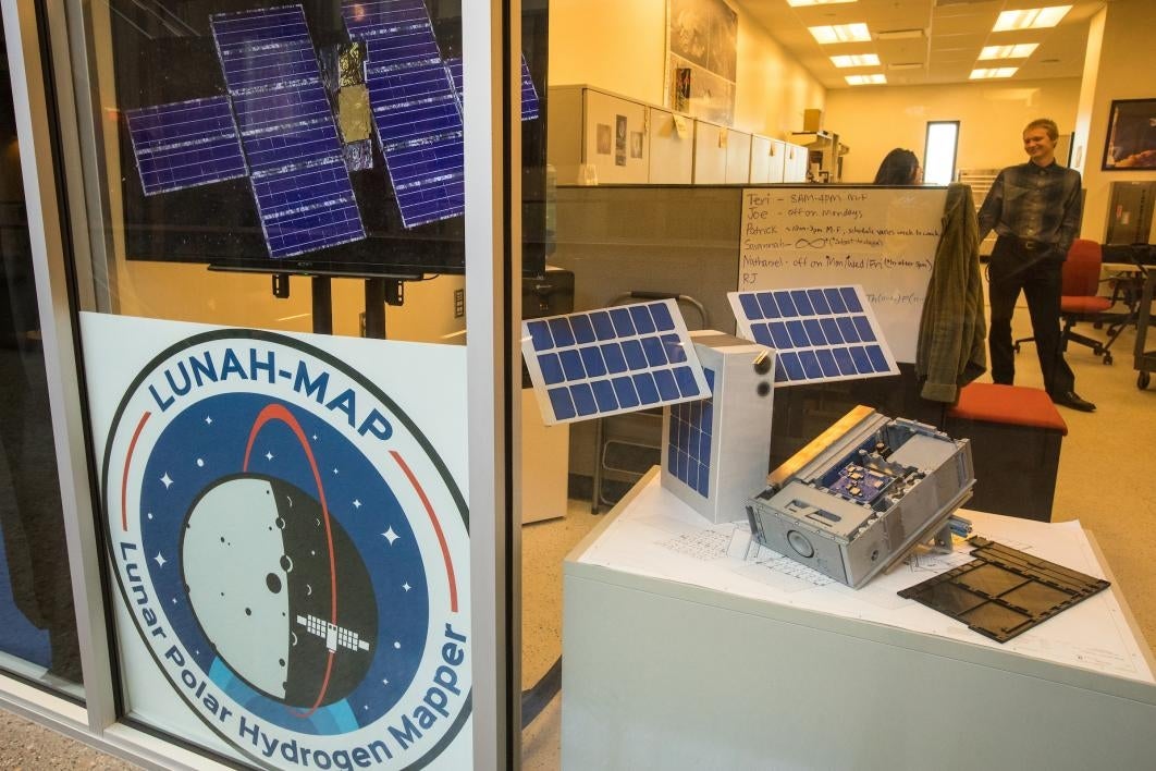 Looking into a space lab from a hallway window