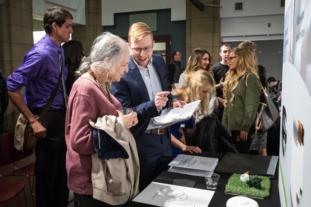 people talking at exhibition