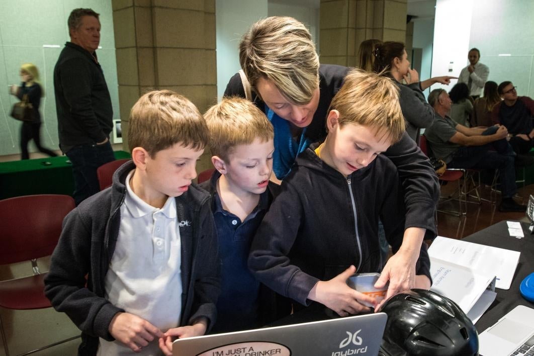 group of kids looking at exhibit