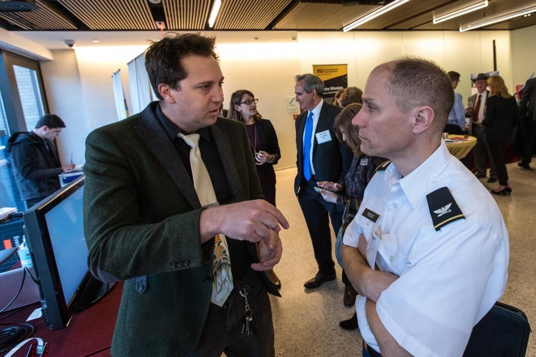 People talk at a reception