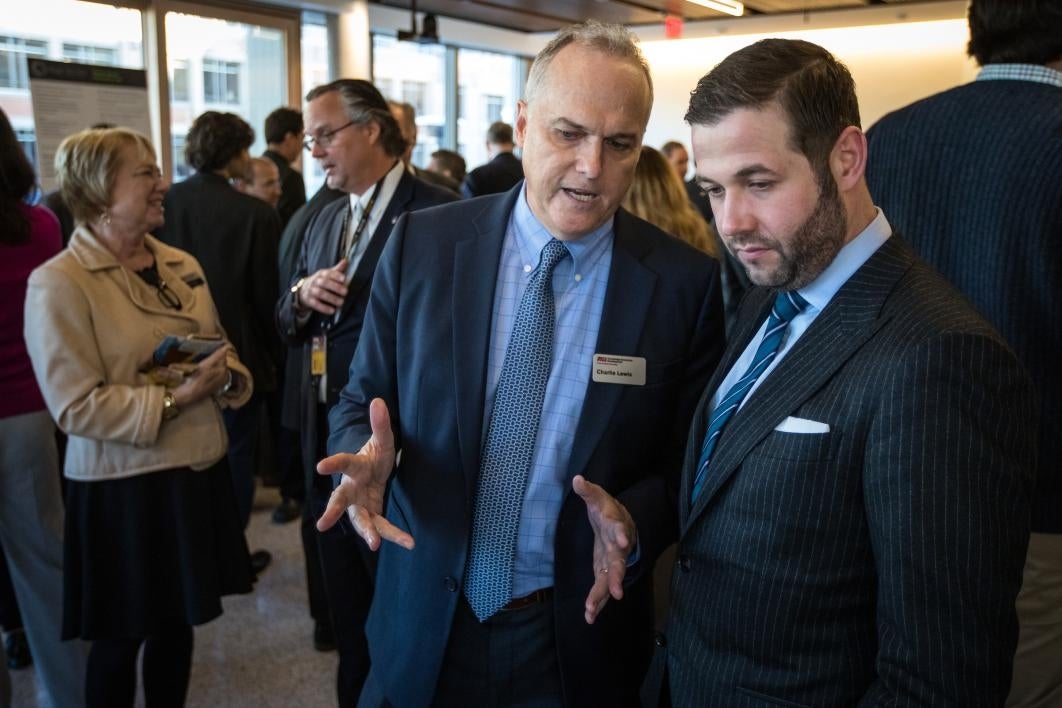 People talk at a reception