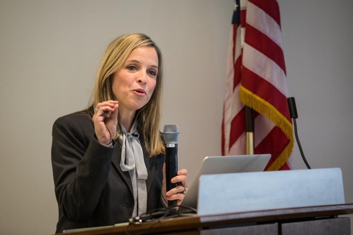 Darlene Cavalier speaks at a podium