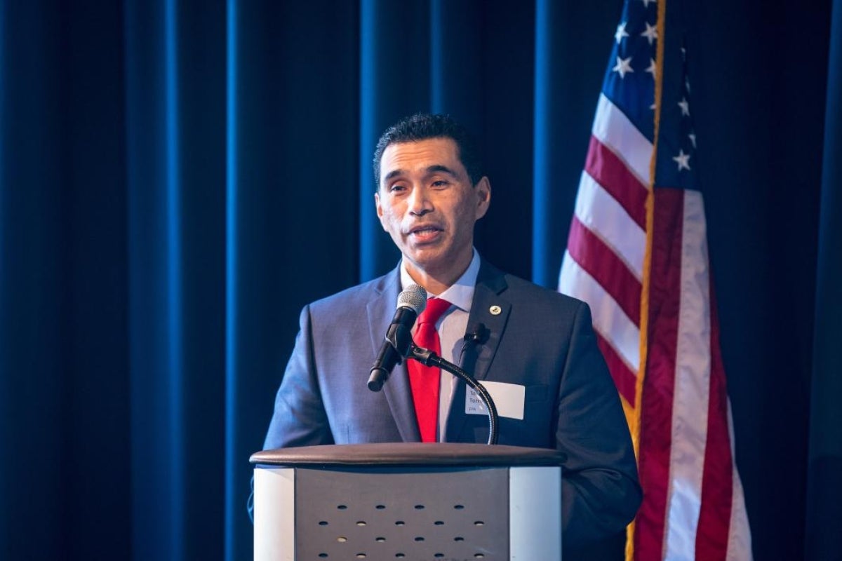 EPA director Tomas Torres speaks at a lectern