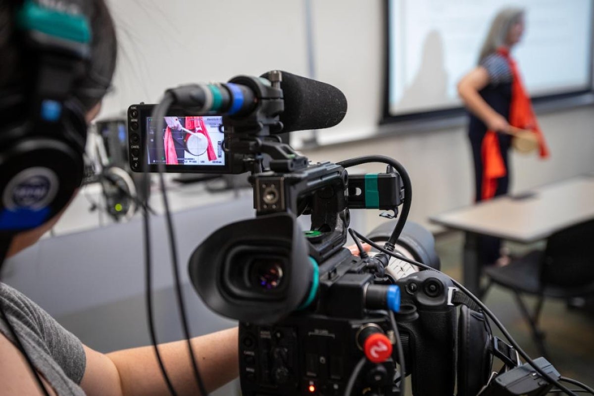 Woman operating a camera