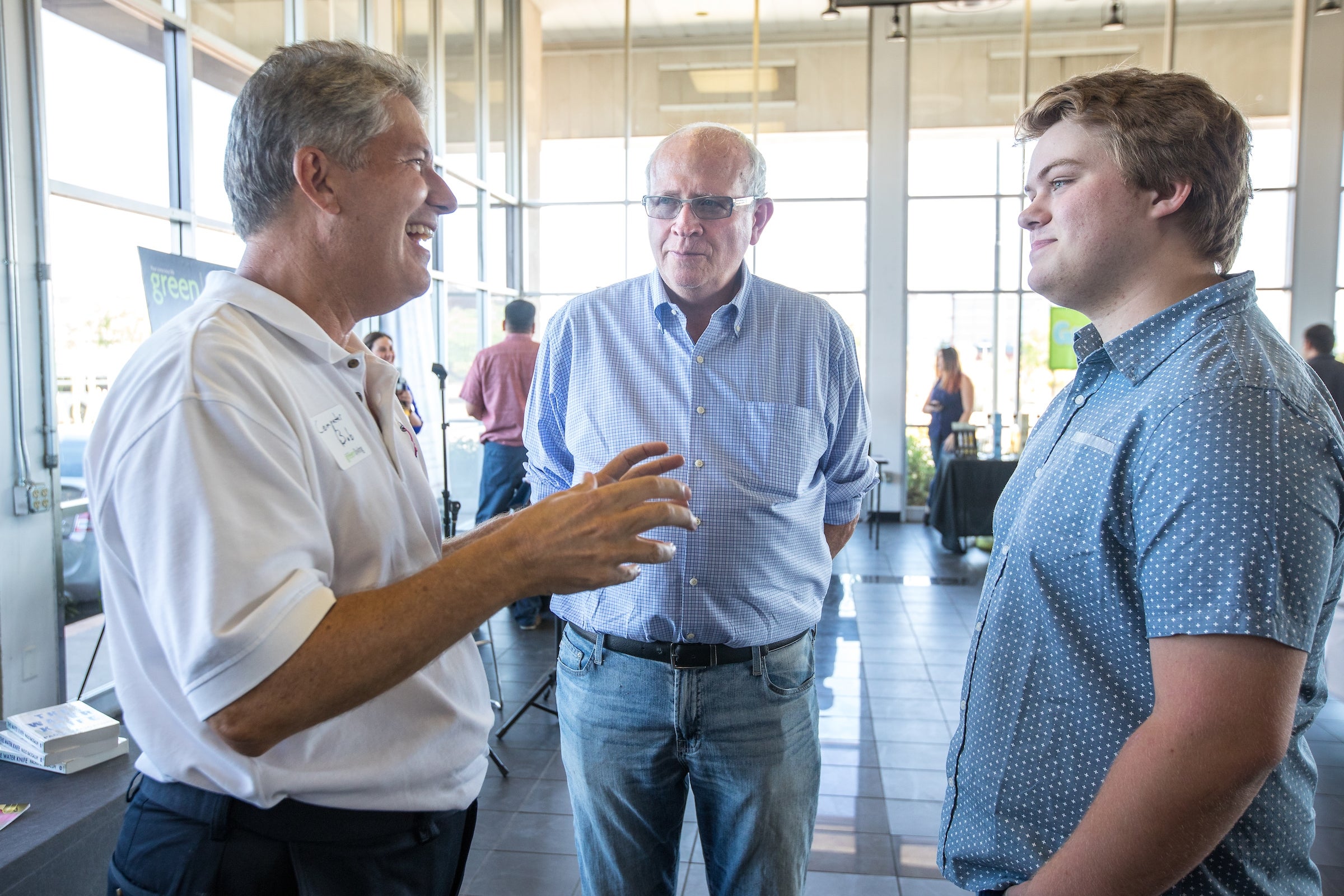 three men talking