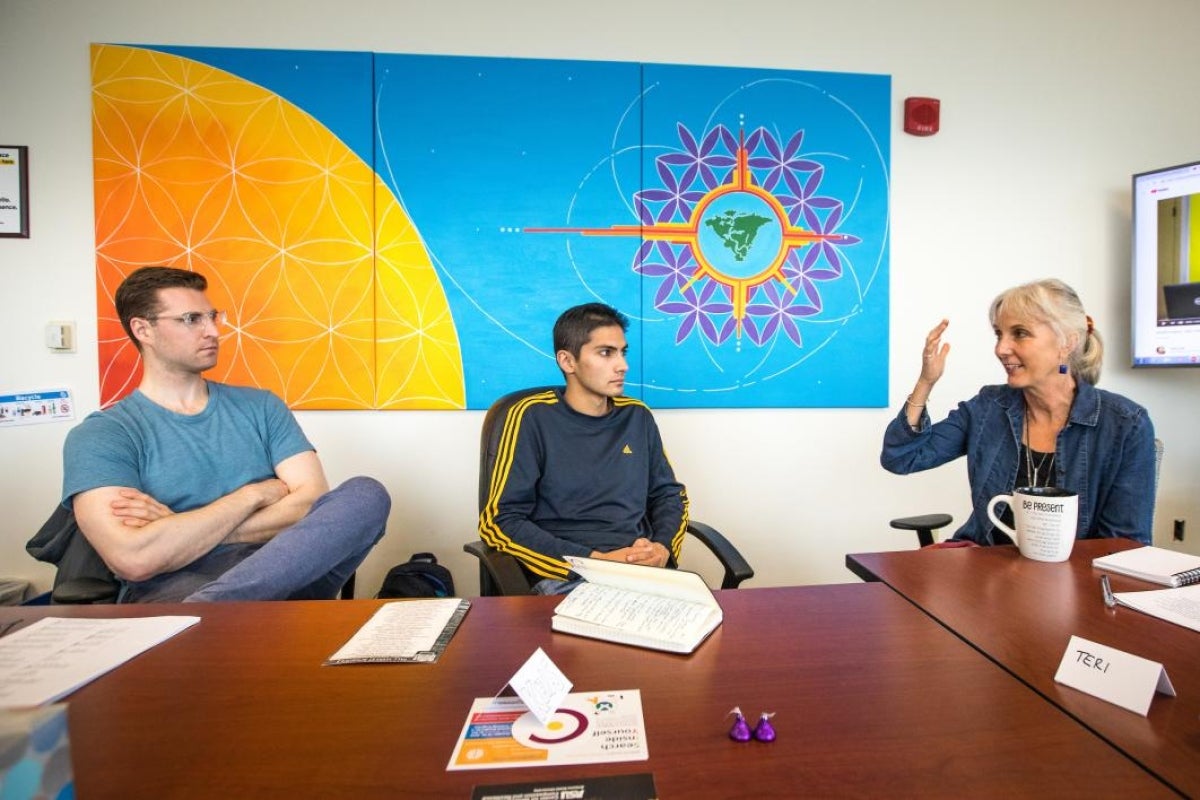 woman talking to students