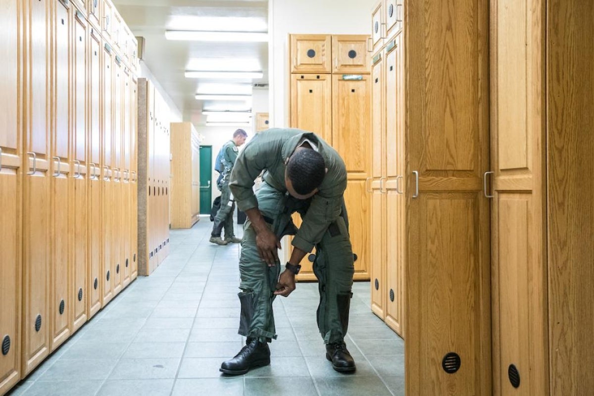 ASU grad student Anthony Lawrence suits up